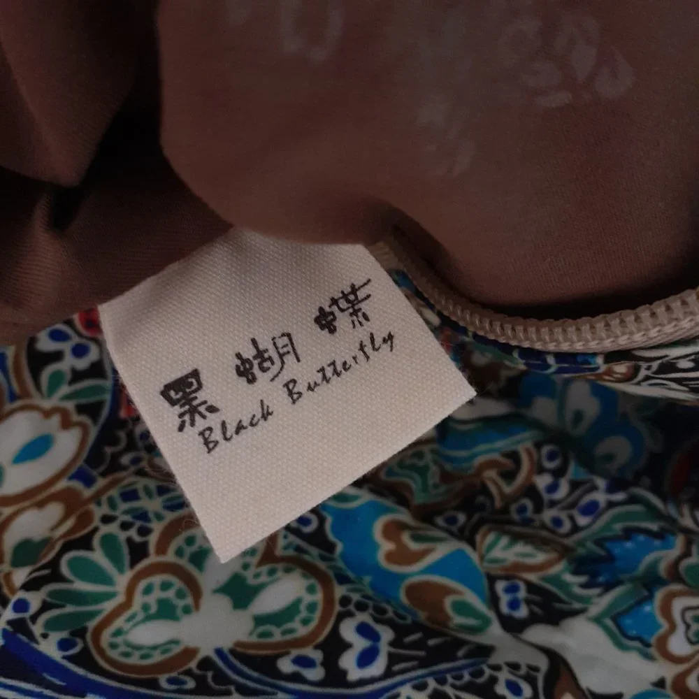 Black Butterfly Canvas Backpack in a Blue Floral Print